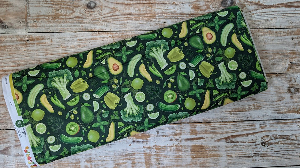 Thumbnail: Green fabric with vegetables, broccoli, avocado, kiwi and lime print on display.