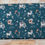 Thumbnail: Teal fabric with squirrels, birdhouses, and foliage; The Fabric Squirrel design.