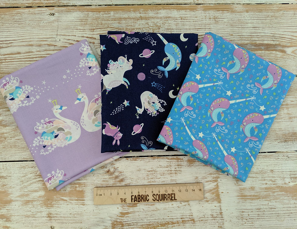 Thumbnail: Three folded fabrics with swans, unicorns, and narwhals, The Fabric Squirrel.