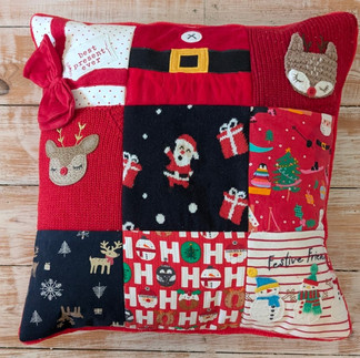 Christmas cushion made from children's first Christmas clothes