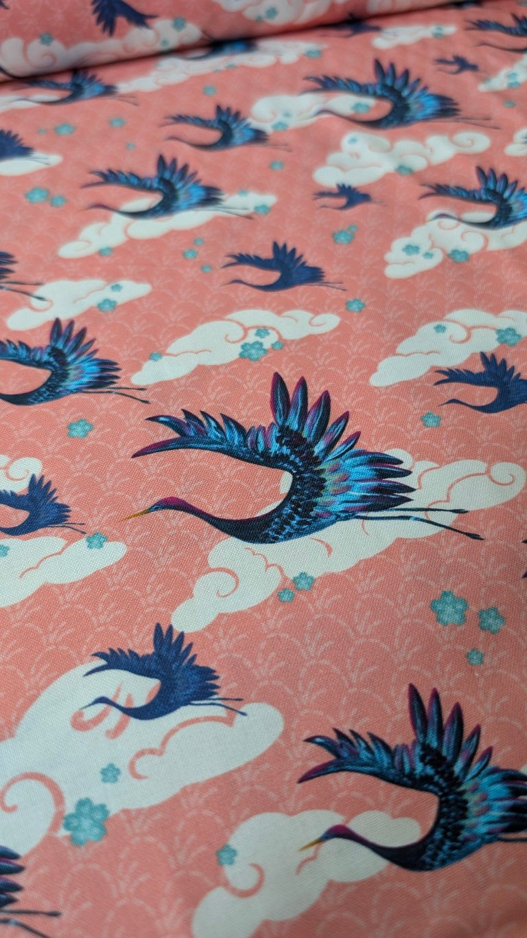 Thumbnail: Flying cranes among clouds on pink fabric, Pink Craine Fabric. The Fabric Squirrel.