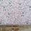 Thumbnail: Fabric with bunnies hanging, pink flowers and The Fabric Squirrel pattern.