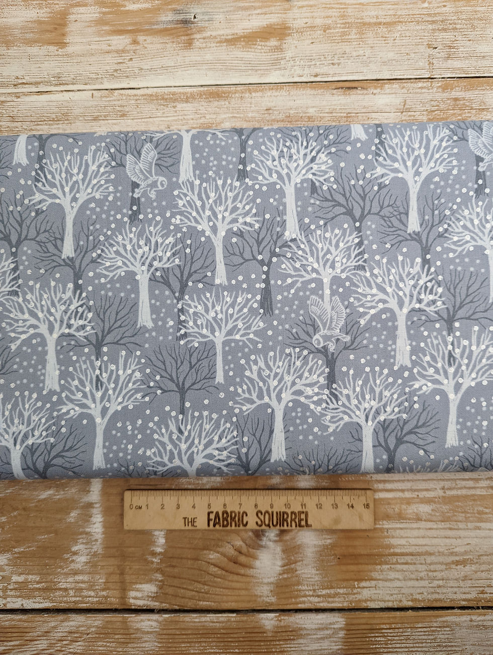 Thumbnail: Grey fabric with white trees and The Fabric Squirrel at the bottom.