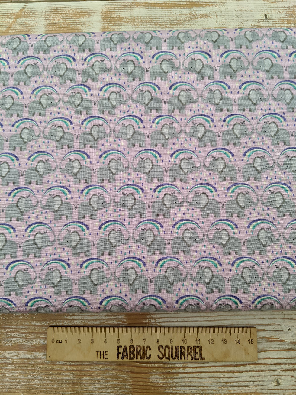 Thumbnail: Pink fabric with repeating pattern of elephants, rainbows and dots.
