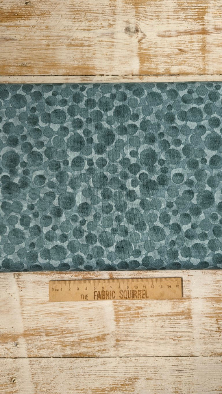 Thumbnail: Abstract pattern of teal circles on fabric, with Fabric Squirrel branding.