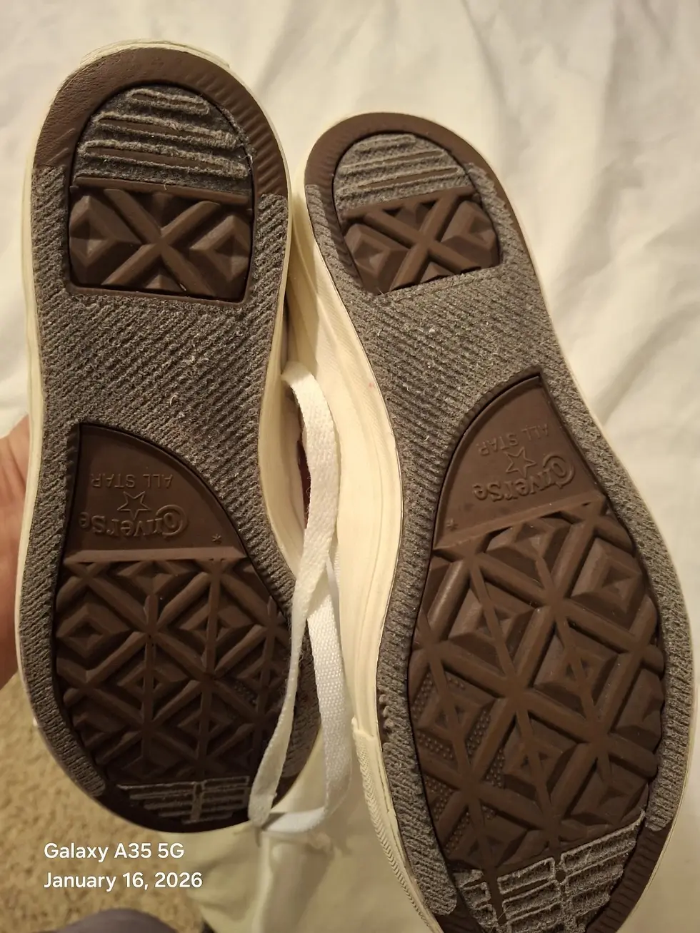 Thumbnail: Bottom soles of White Converse Chuck Taylor Low Tops