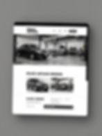 Layout de site automotivo em preto e branco exibido em tablet.