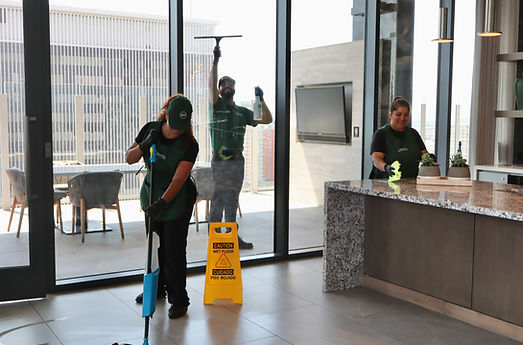 Cleaning crew sanitizing modern office