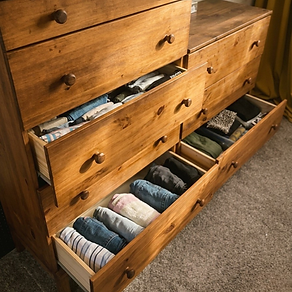 Neatly folded clothing in dresser