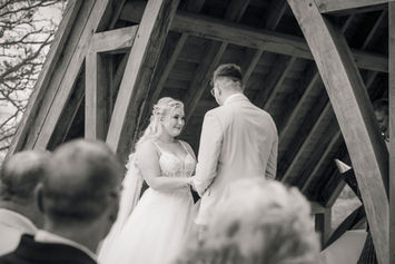 Bride and groom during outdoor ceremony