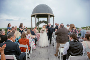 Bride and groom walking Back up the aisle after ceremony Hydro Hotel
