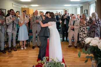 Bride and groom first kiss at Haywards Heath Town Hall, East Sussex