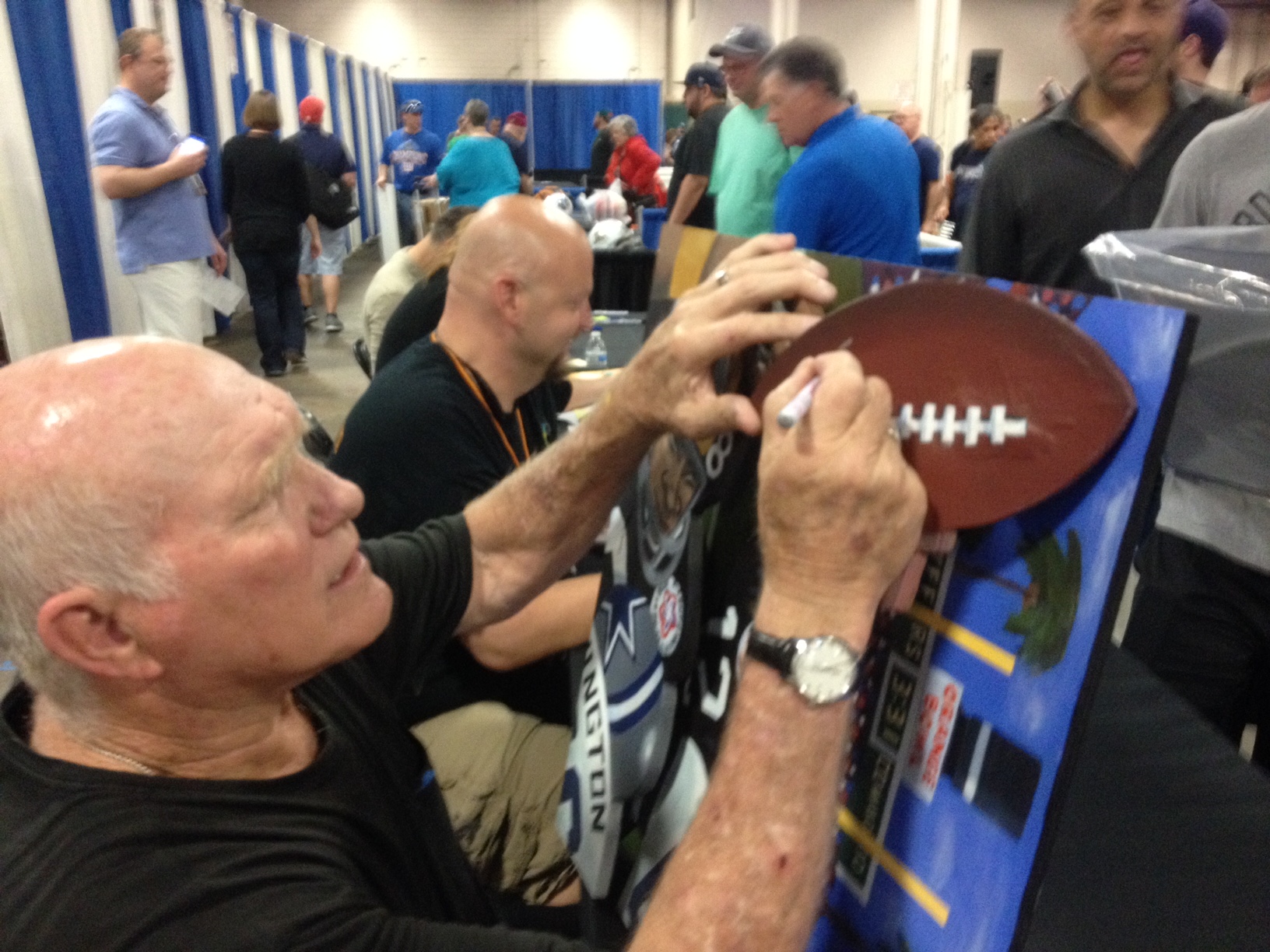 Sax Terry Bradshaw signing football