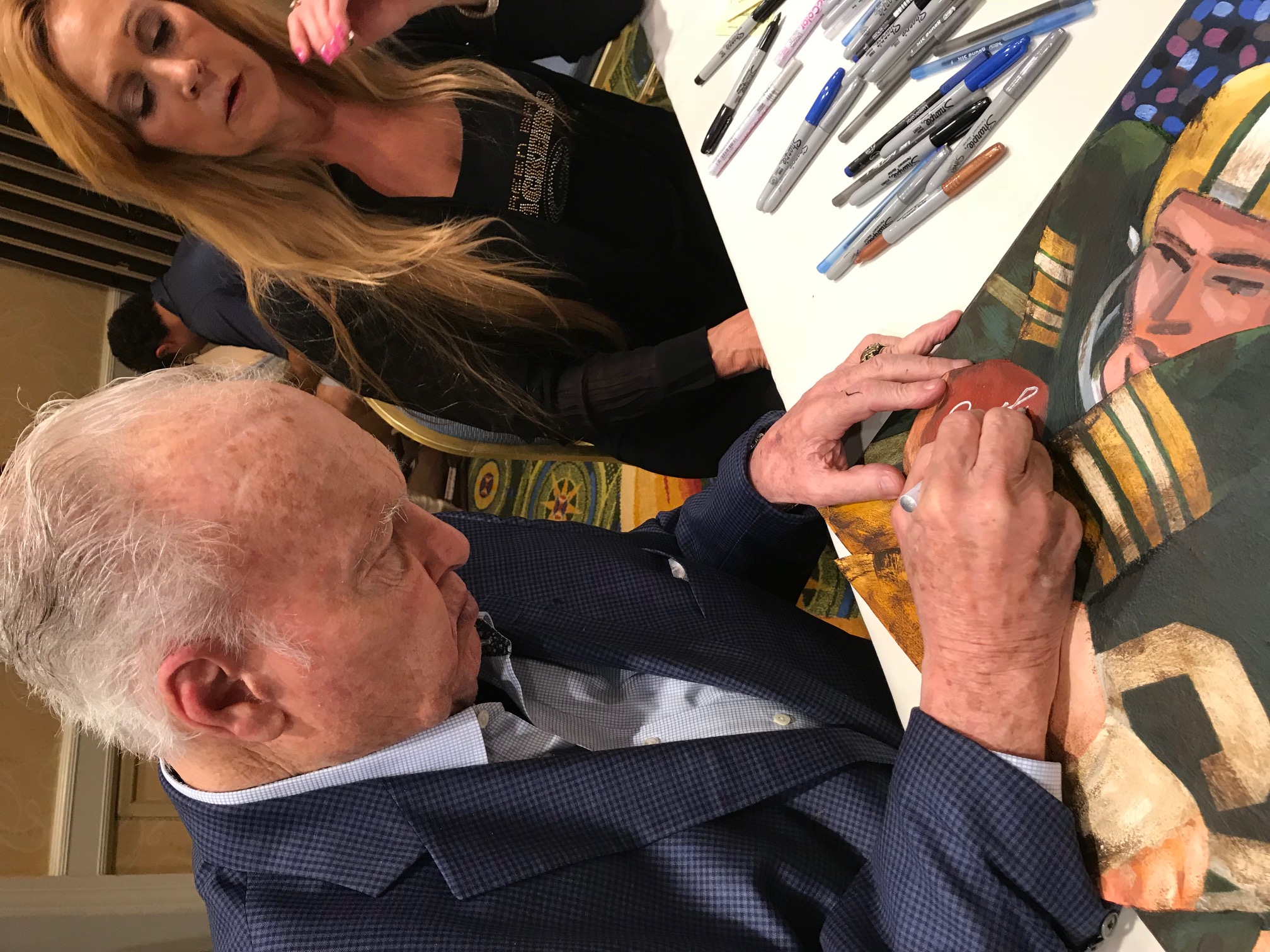 Paul Horning signing painting