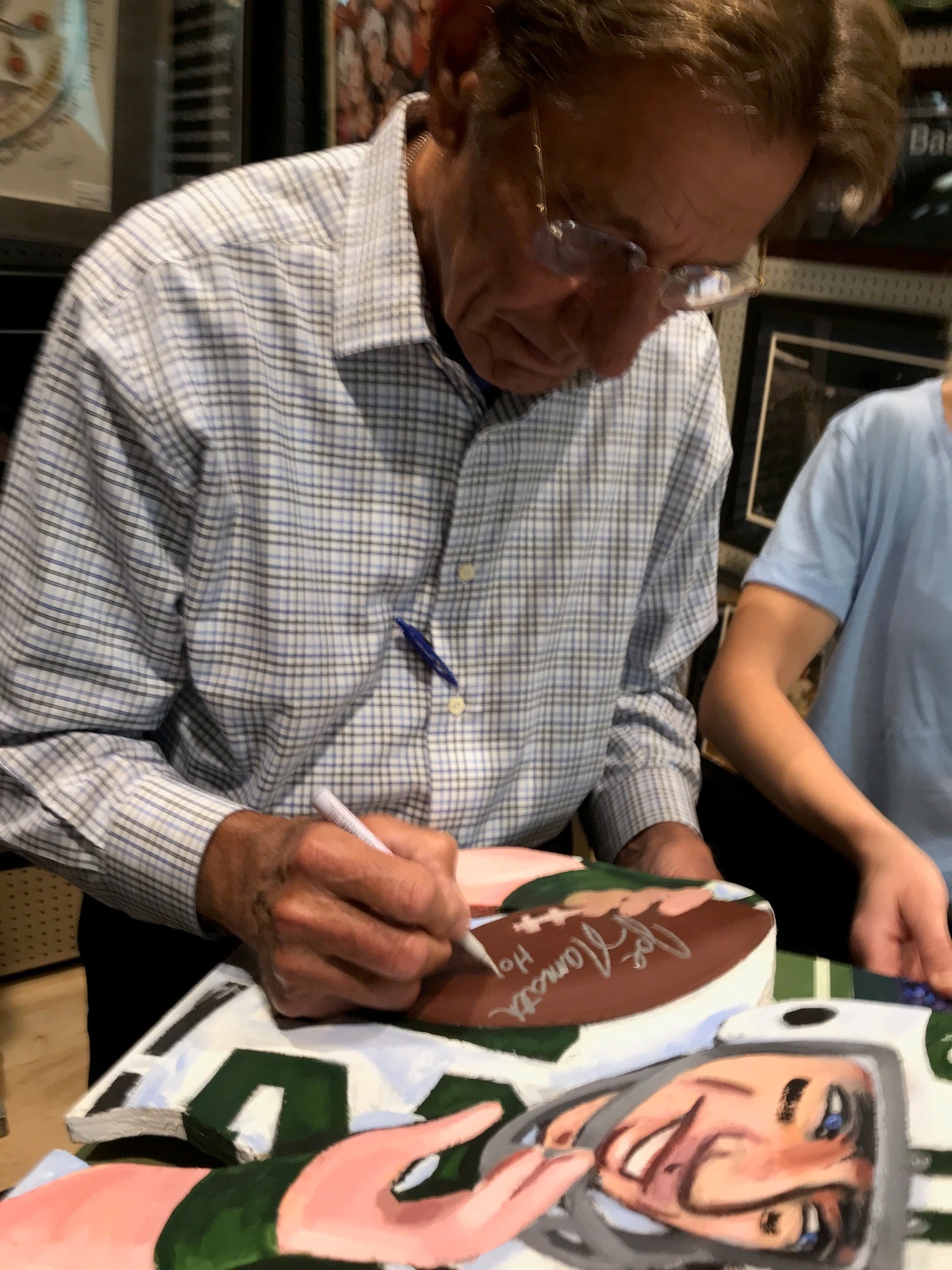Namath signing painting