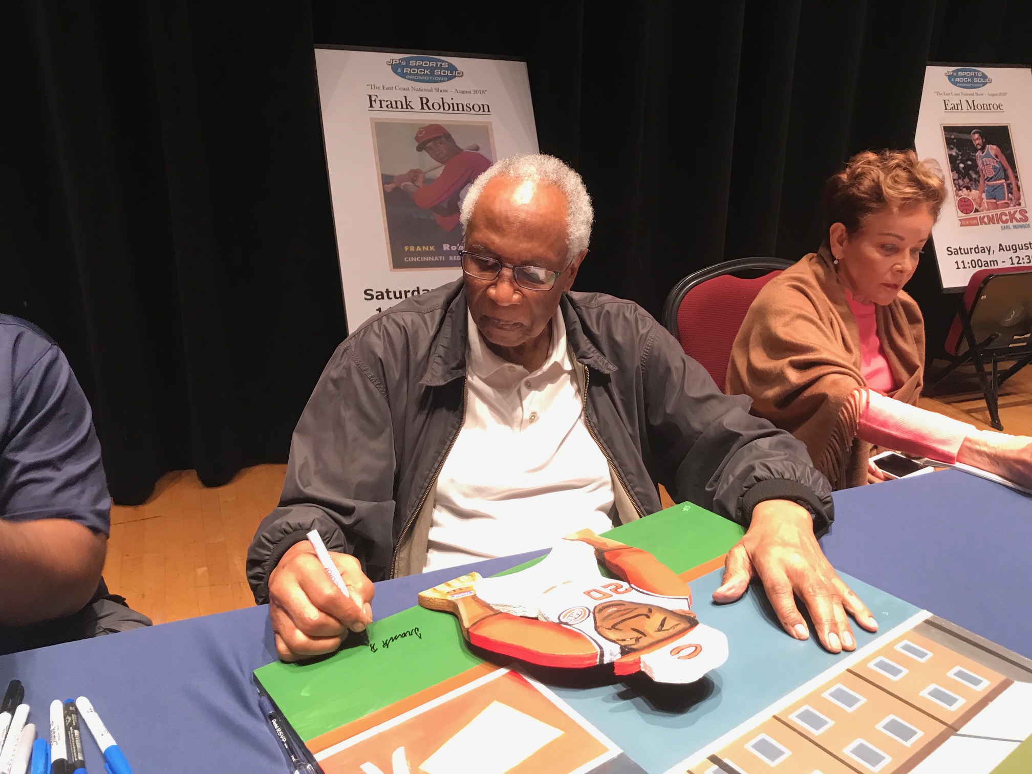 Frank Robinson signing painting