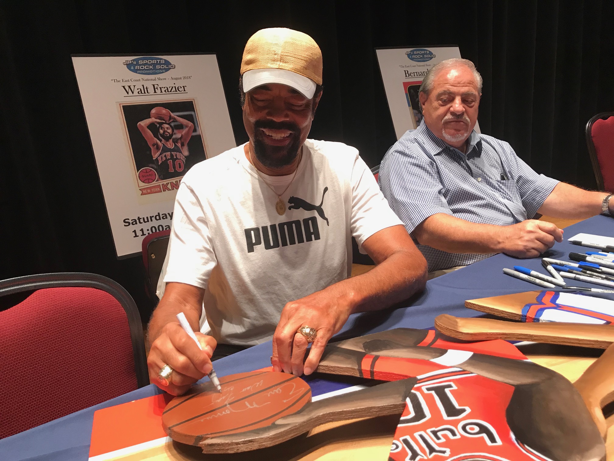 Clyde signing painting