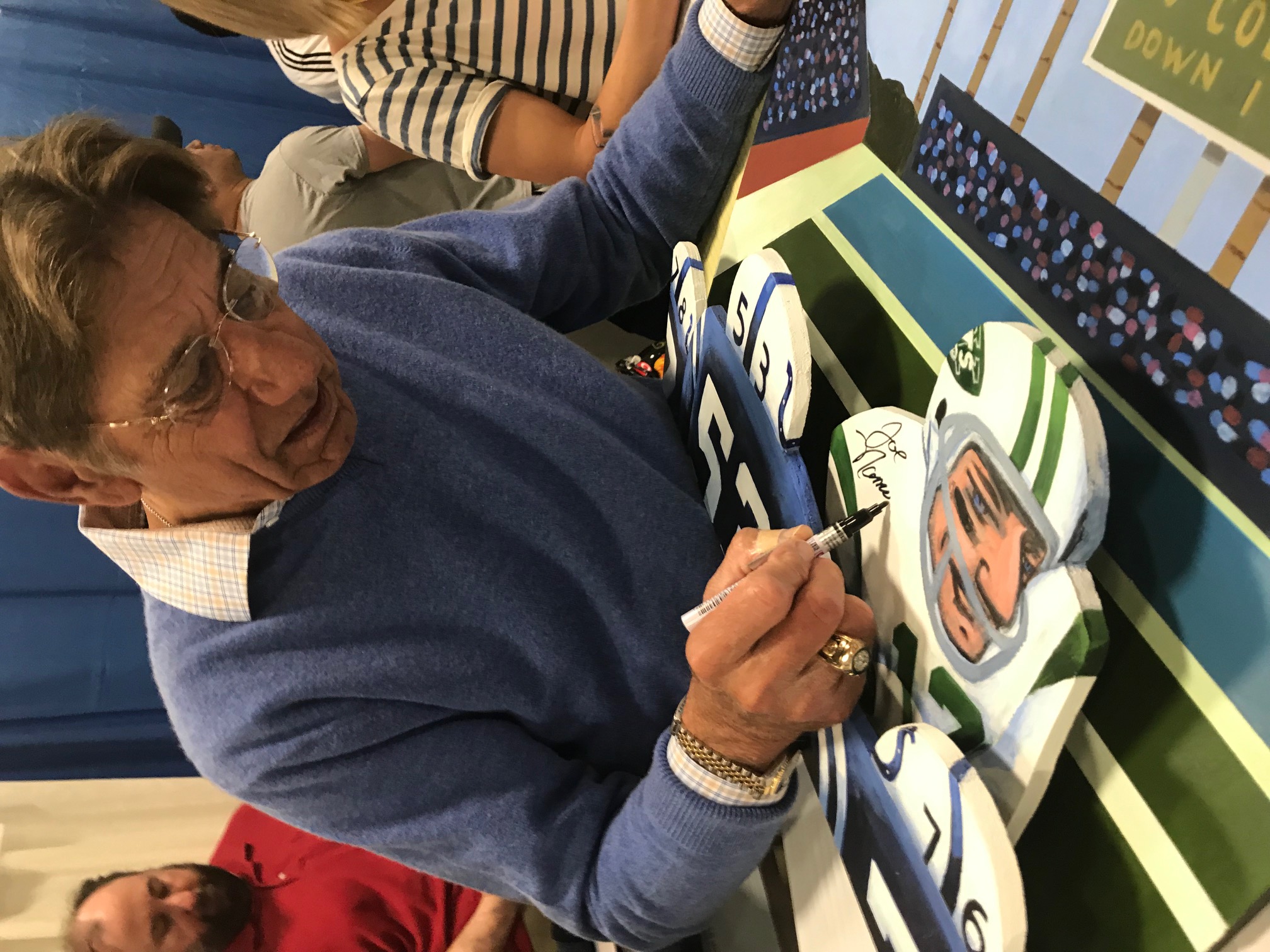 Joe Namath signing painting