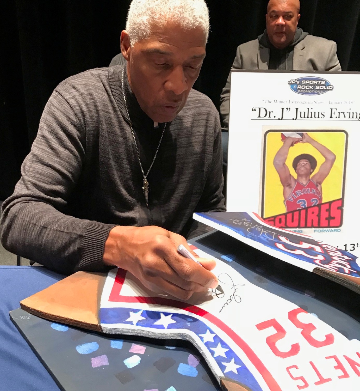 Dr. J signing