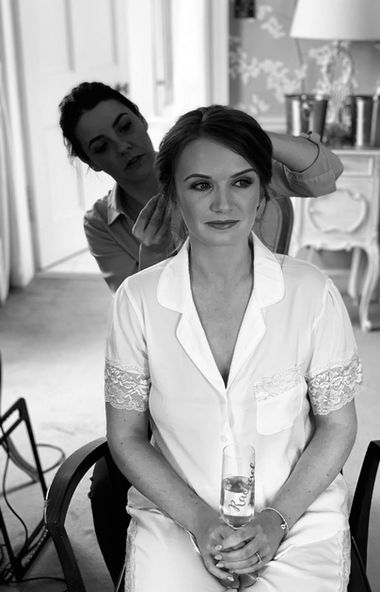 Bridal hair specialist Mandy from Hair Ups styling a bride on her wedding morning in Scotland