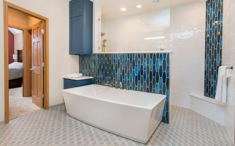 Free-standing White Tub in Front of Walk-in Shower Blue Ceramic Accent Tile