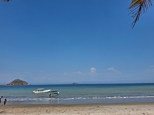 Sandy beach with calm waters at Playa Blanca near Playa Naranjo