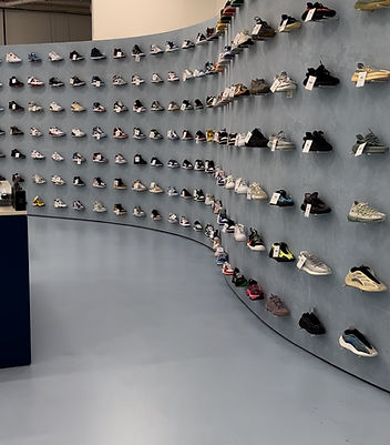 Custom retail shoe store construction with curved feature wall and custom finishes completed by JD Building Group.