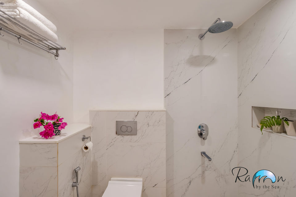 Marble tiled shower with niche
