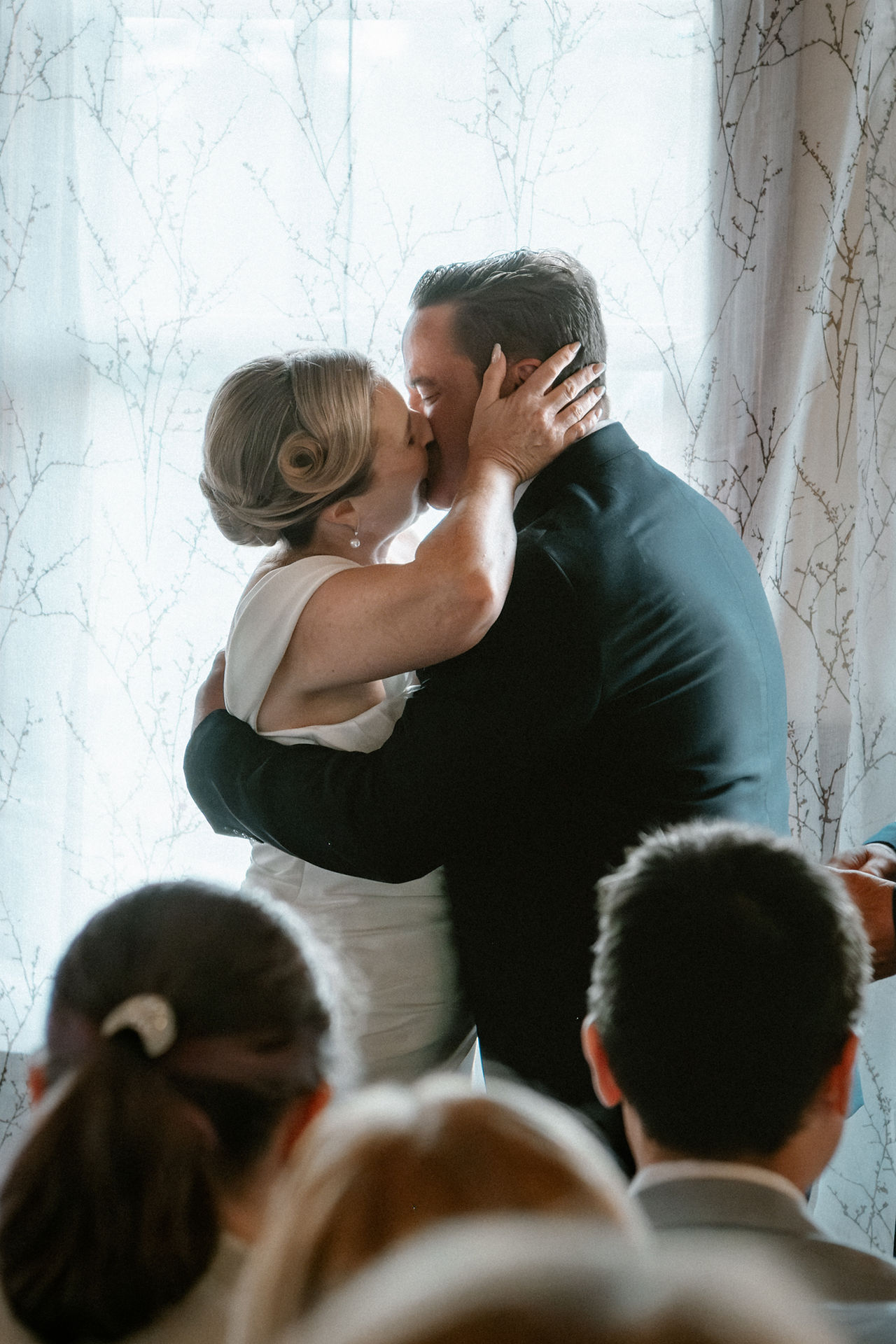 The bride and groom kiss at the end of the cremony.