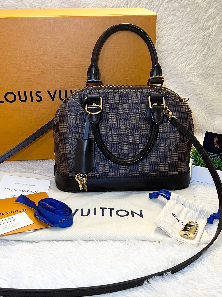 Authentic LOUIS VUITTON Alma BB in Damier Ebene.