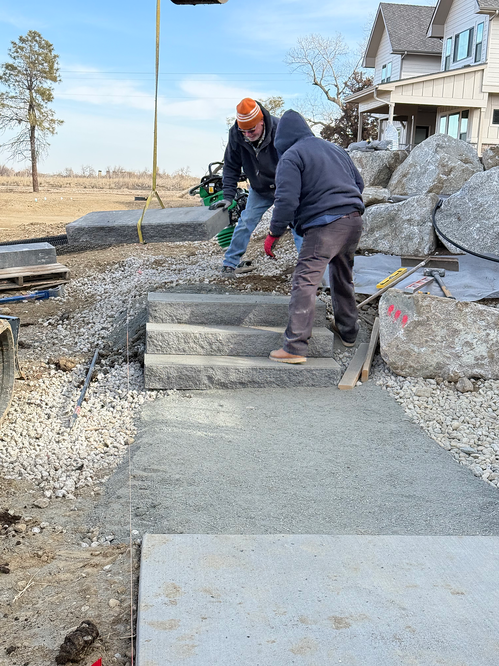 Grow Boulder team installing stone hardscape in colorado home