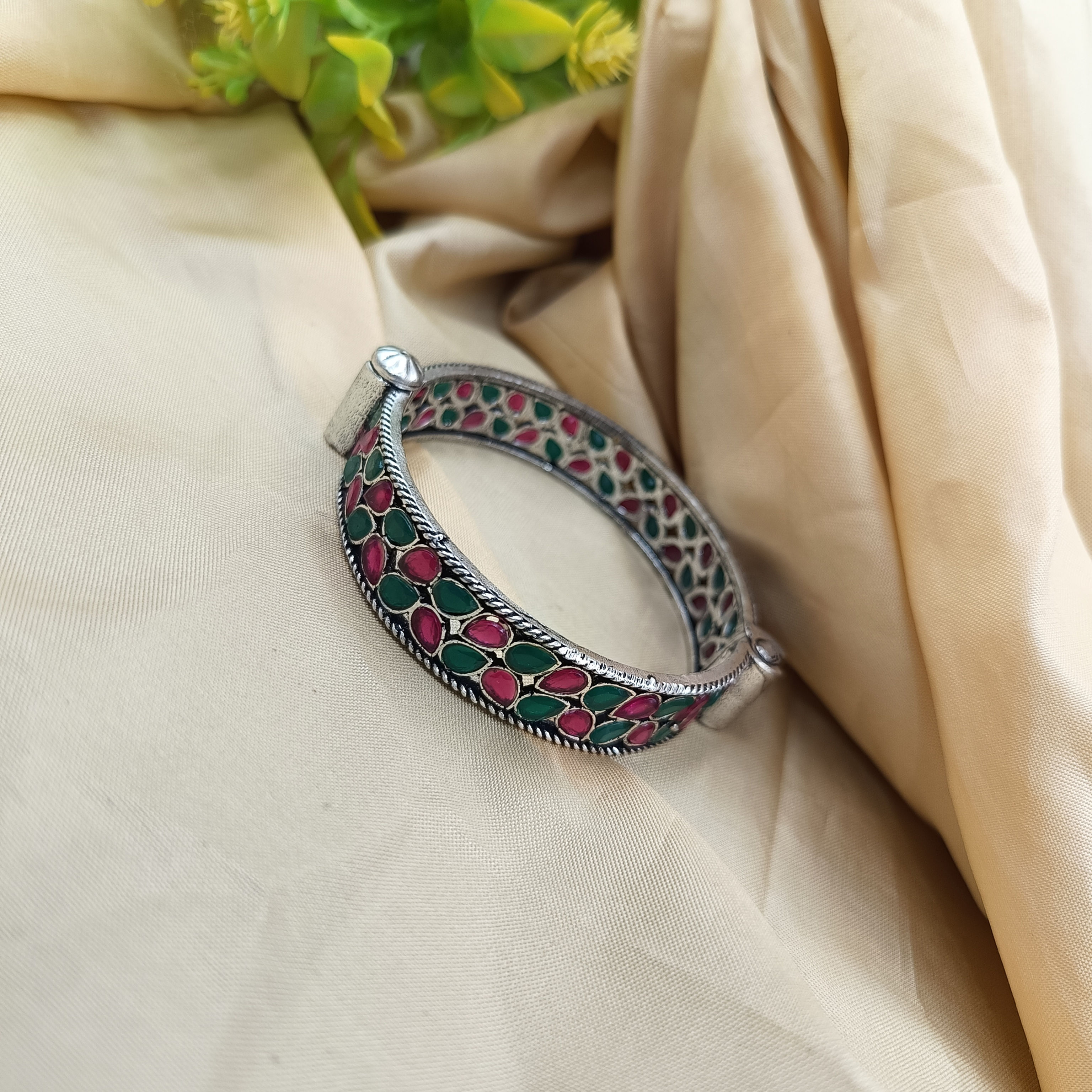 Oxidised silver stone-set openable kada bangle with jali work, ruby red and emerald green stones, ethnic Indian jewellery