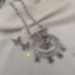 Boho festival jewelry necklace set featuring an ornate oxidized center pendant and matching drop earrings.