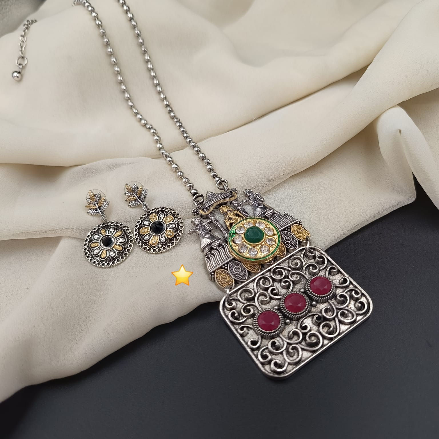 Traditional Indian jewelry silver tone statement necklace with detailed metalwork and matching statement earrings.