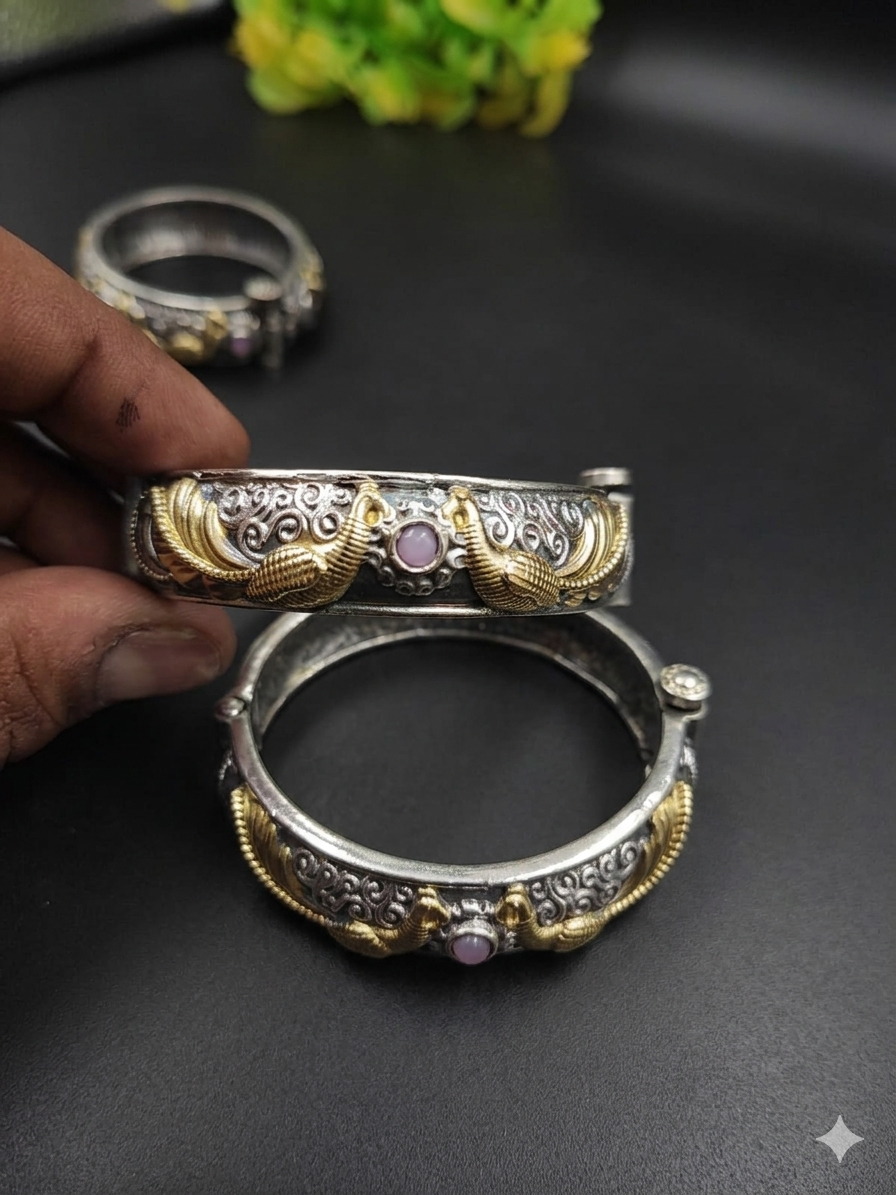 Dual tone oxidised brass peacock kada bangle with gold wing motif and gemstone centre, handcrafted Indian jewellery