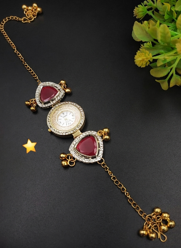 Gold plated Kashmiri bracelet watch with ruby red triangular stones and white crystal borders in triangular motif design with