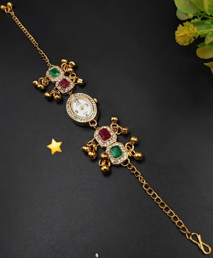 Gold plated Kashmiri bracelet watch with emerald green and ruby red artificial stones, Kundan style setting, and dangling