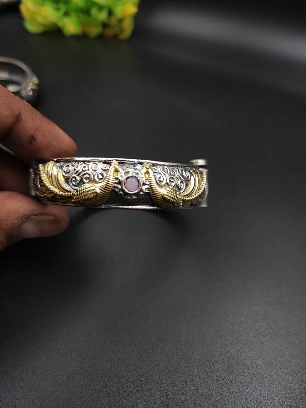 Dual tone oxidised brass peacock kada bangle with gold wing motif and gemstone centre, handcrafted Indian jewellery