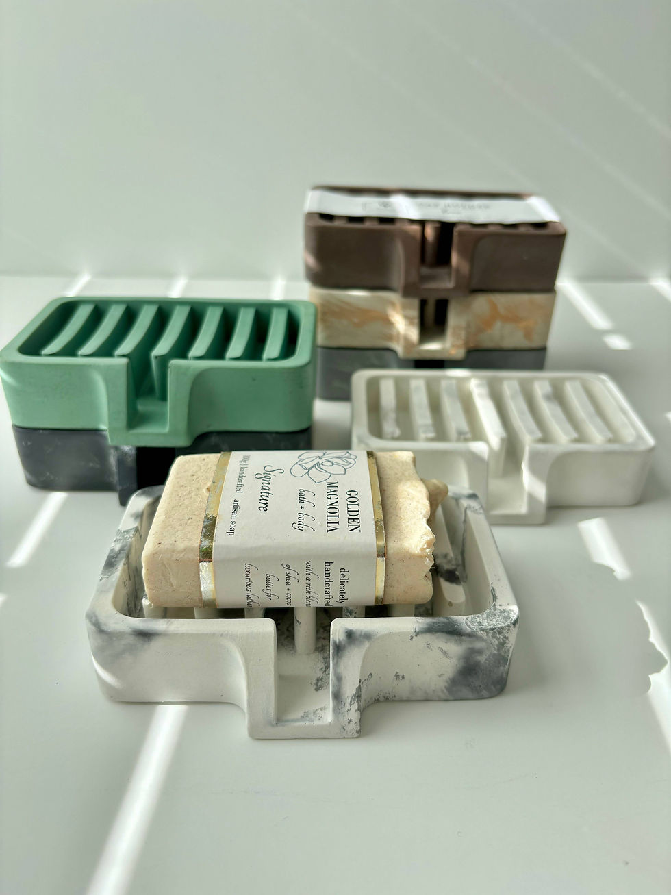 Soap dishes in various colors and materials