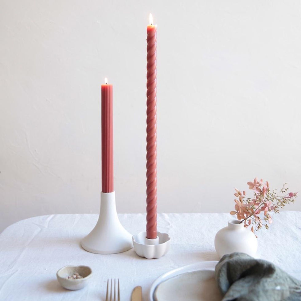 Thumbnail: Two terracotta candlesticks with a white vase