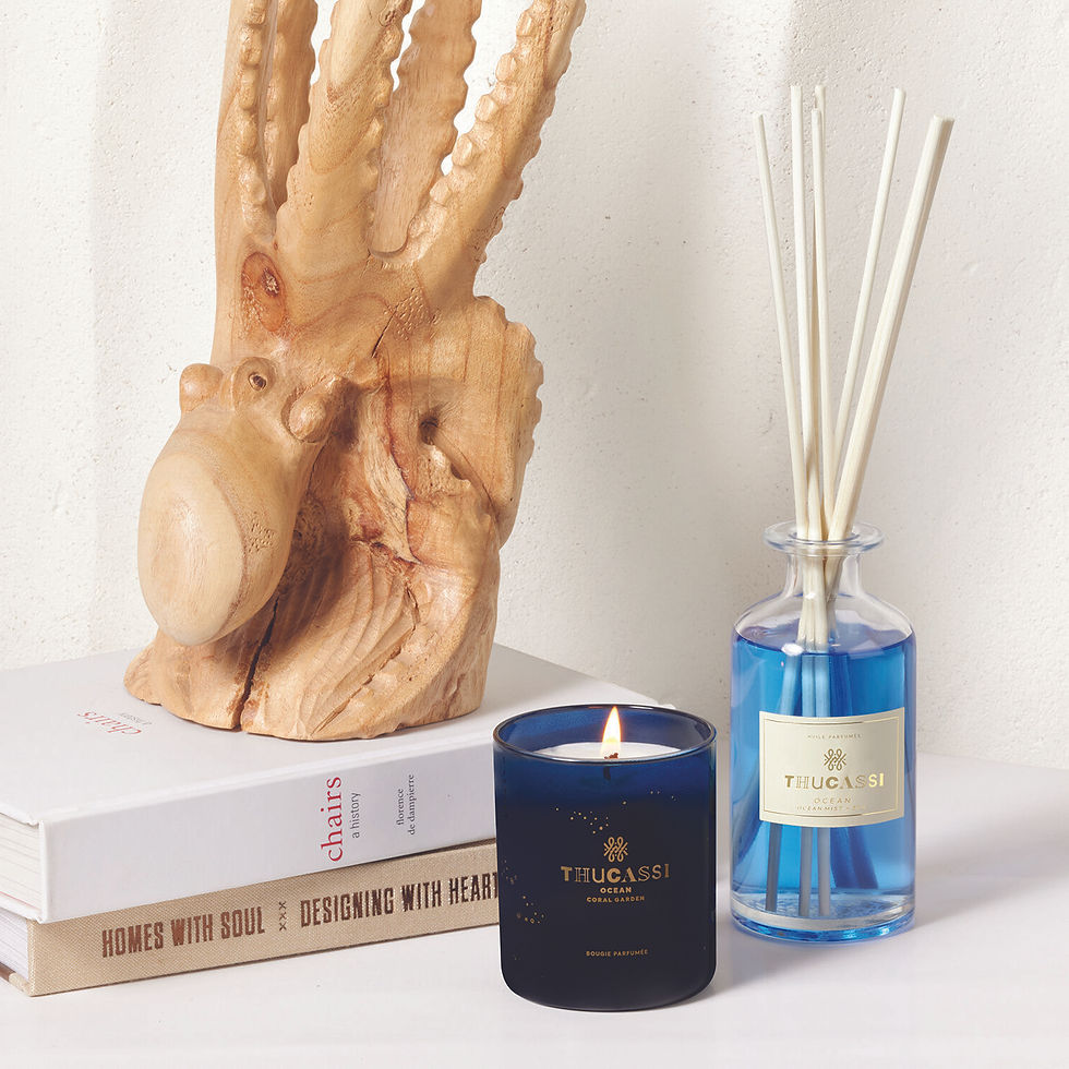 Thumbnail: Wooden octopus sculpture, candle, diffuser, books