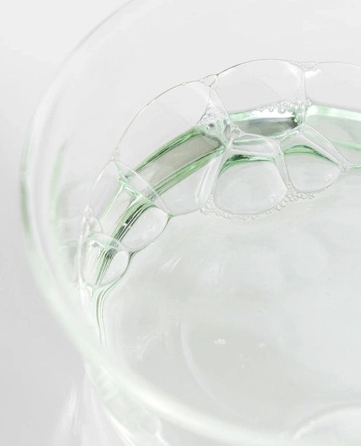 Close-up of a clear glass bowl with bubbles