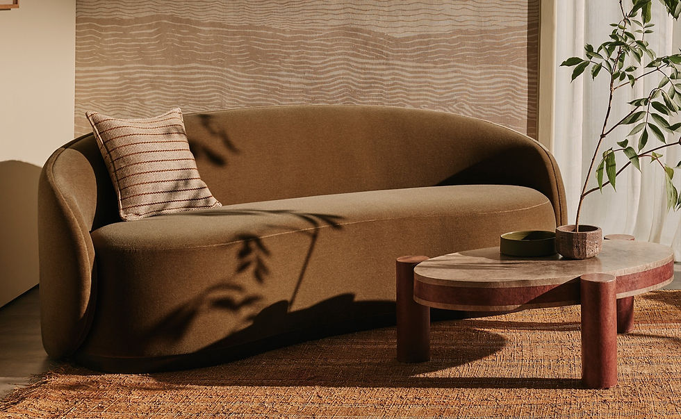 Close-up of a textured linen sofa with decorative pillows and a woven basket