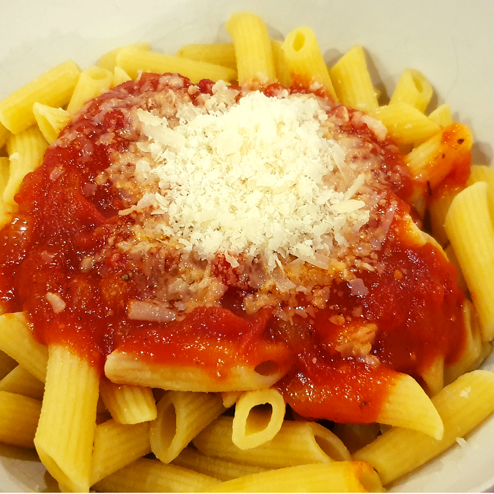Serve over pasta, with a sprinkling of parmesan cheese.