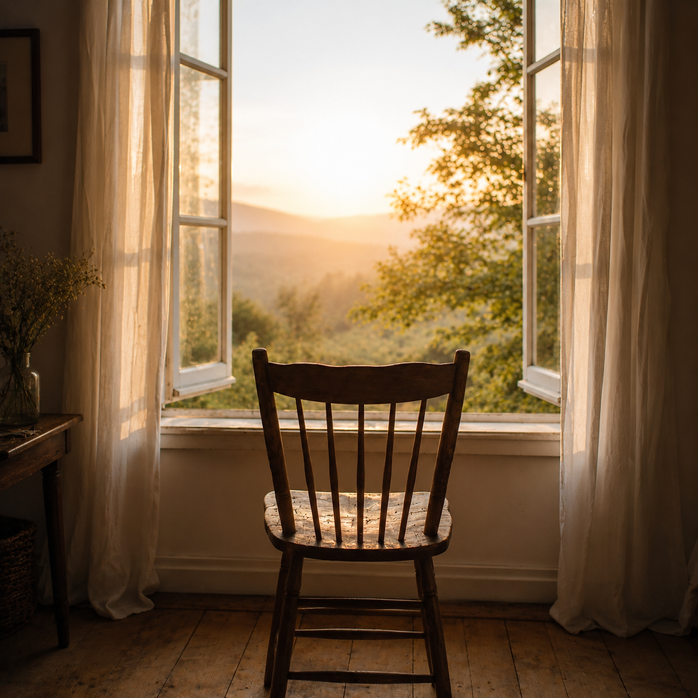 an empty chair looking out of an open window ontoa misty morning countryside scene