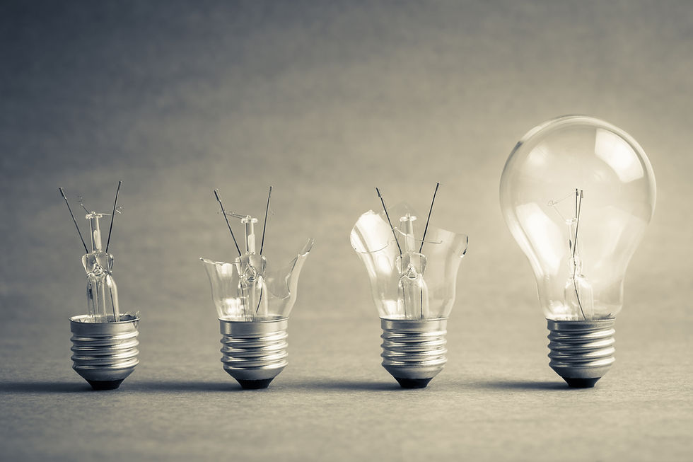 four light bulbs in a row, three of which are broken, each more broken than the other.