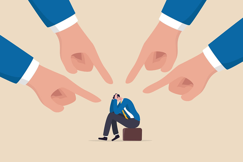 An illustration of large fingers pointing at a person sitting on a briefcase, their head in their hands