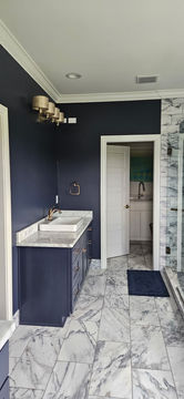 Luxury bathroom painted dark blue with Sherwin-Williams Duration - front angle view - by Bourbon Country Painting in Louisville, Kentucky.