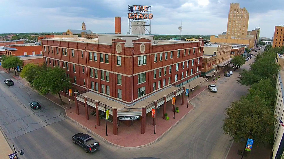 An aerial view of The Grace Museum building in Abilene, Texas, showcasing its historic architecture and surrounding streets.