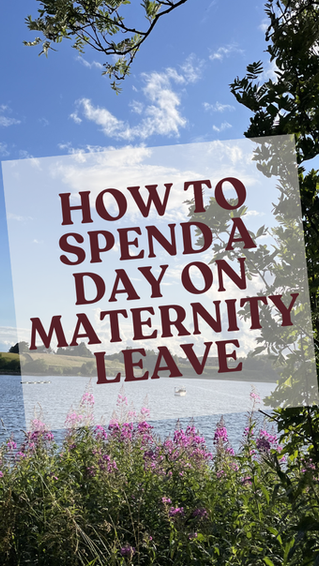 Lakeside scene with purple flowers, trees, and blue sky. Text reads "HOW TO SPEND A DAY ON MATERNITY LEAVE." Tranquil mood.